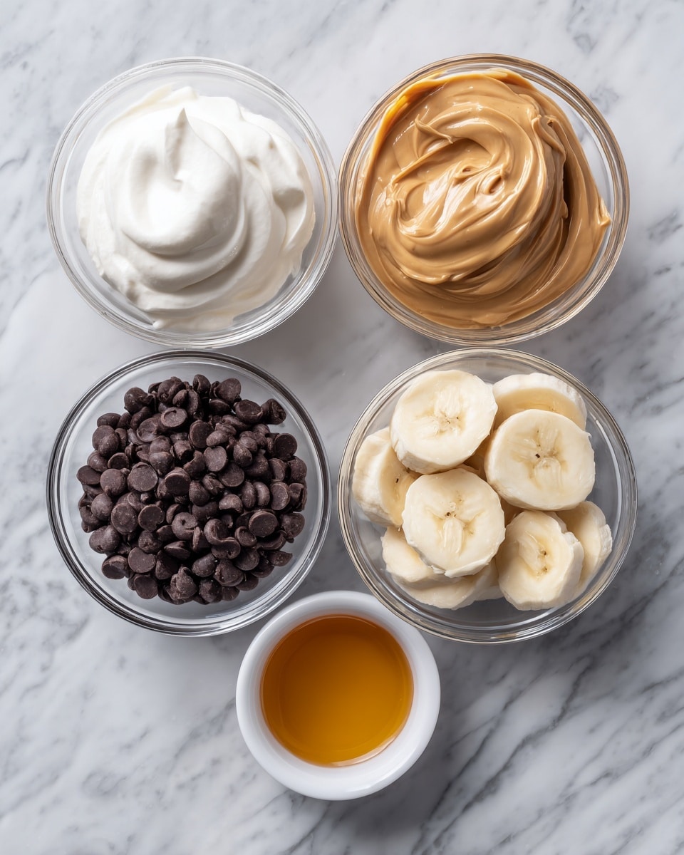 The image shows five clear glass bowls and one small white bowl arranged on a white marbled surface. The top left bowl contains smooth, white whipped cream with a soft, fluffy texture. To its right is a bowl filled with a light brown, creamy peanut butter sauce. Below the peanut butter is a bowl with round slices of banana, showing the pale yellow flesh and soft texture. Directly left of the bananas, there is a bowl full of small dark brown chocolate chips, smooth and shiny. Below the chocolate chips is a small white bowl with golden honey, slightly thick and liquid. All the bowls are neatly arranged in a rectangular layout. photo taken with an iphone --ar 4:5 --v 7