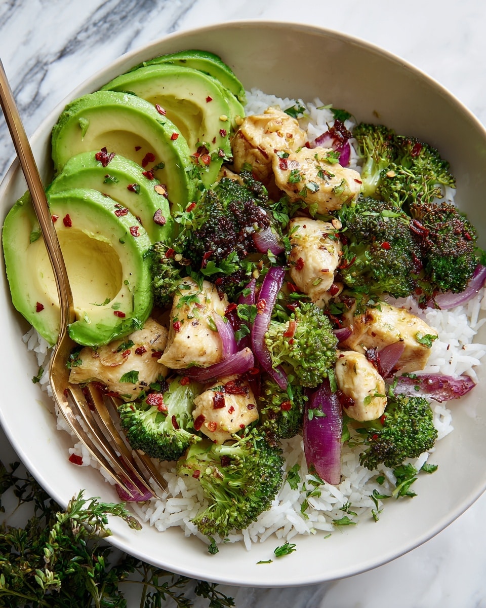A white bowl filled with three main layers: the bottom layer has white rice, the middle layer has bright green broccoli pieces, and the top layer is made of light-colored cooked chicken pieces sprinkled with chopped green herbs and red pepper flakes. On top of the chicken are thin sliced rings of purple onion, and on one side of the bowl there are neatly placed slices of yellow-green avocado with some red pepper flakes. A golden spoon rests inside the bowl and the bowl is placed on a white marbled surface photo taken with an iphone --ar 4:5 --v 7
